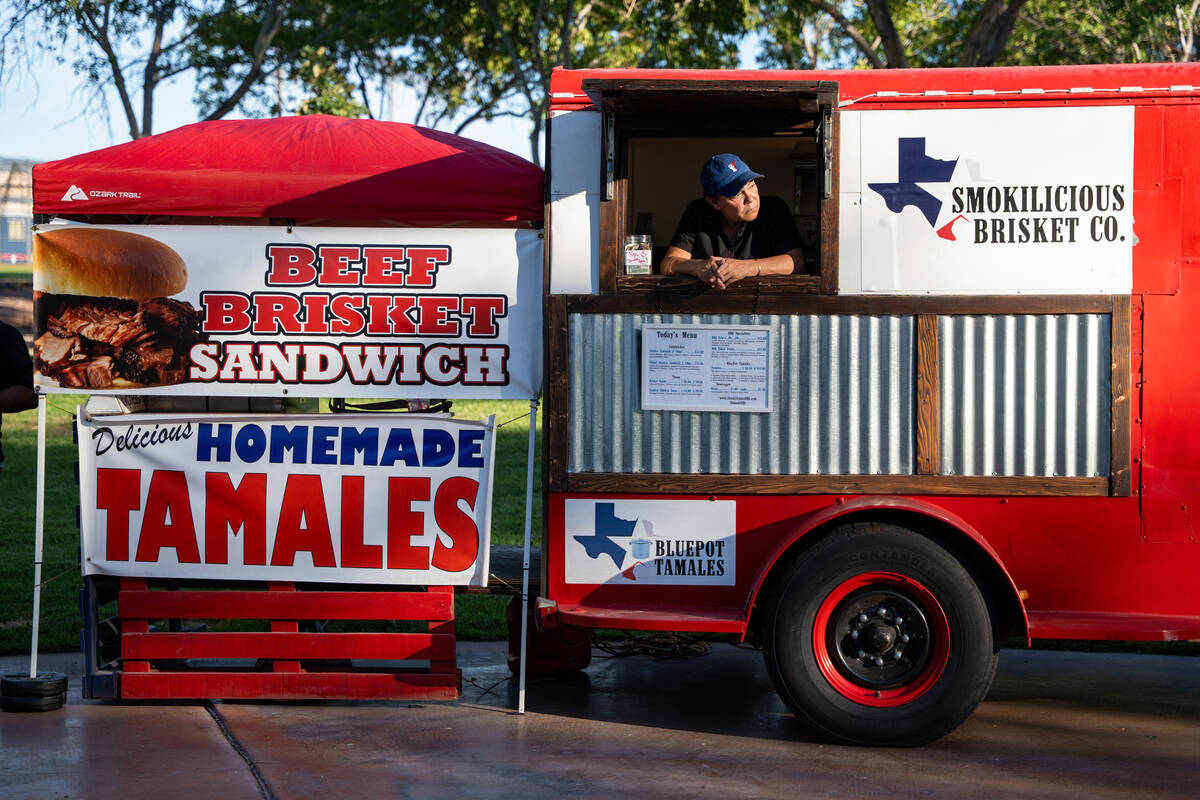 Lisa Barker, co-owner of Smokilicious Brisket Co., waits for customers in her vendor trailer at ...