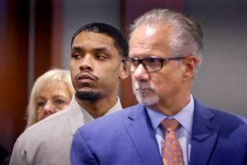 Isaac George, center, who is accused of killing Angelina Erivas, 11, in 2018, stands in court w ...