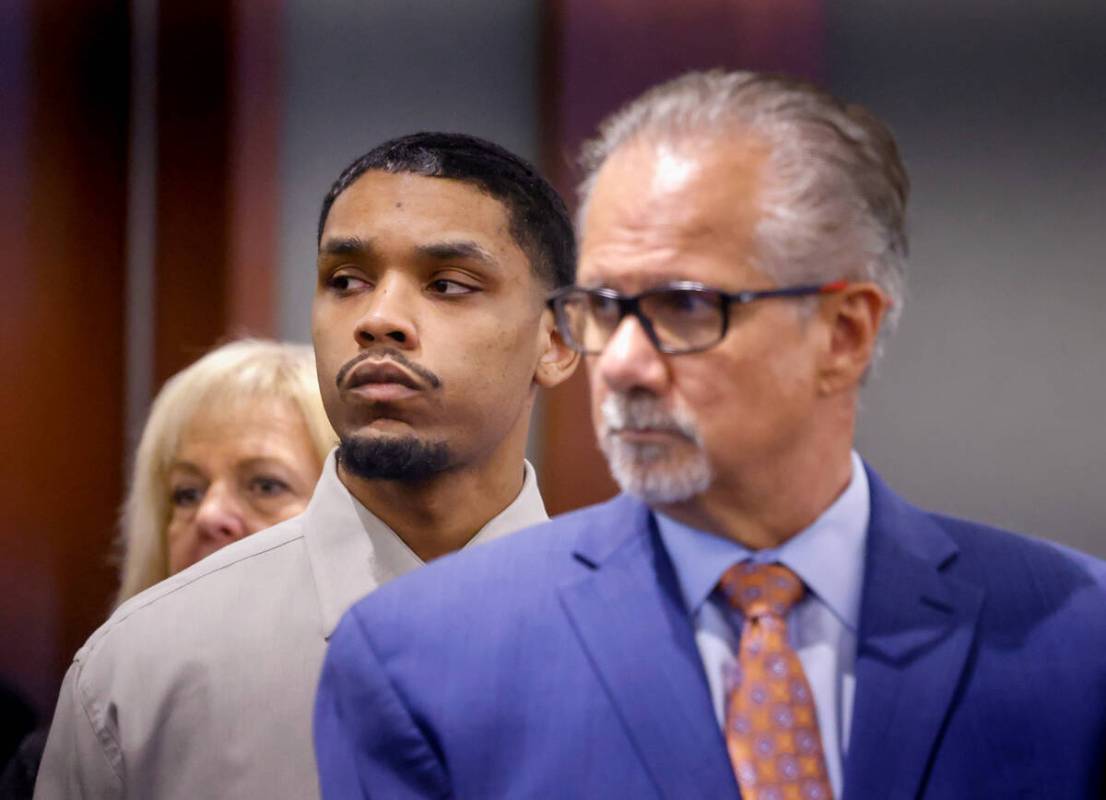 Isaac George, center, who is accused of killing Angelina Erives, 11, in 2018, stands in court w ...