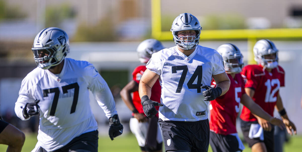 Raiders offensive tackle Kolton Miller (74) warms up with teammates during the third day of tra ...