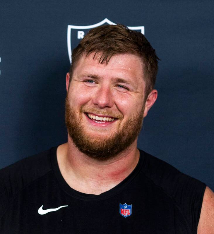 Raiders offensive tackle Kolton Miller (74) laughs during an interview on the third day of trai ...