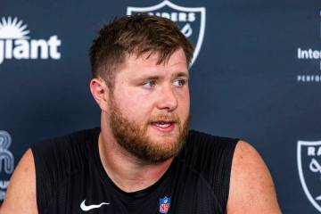 Raiders offensive tackle Kolton Miller (74) answers a question during an interview on the third ...
