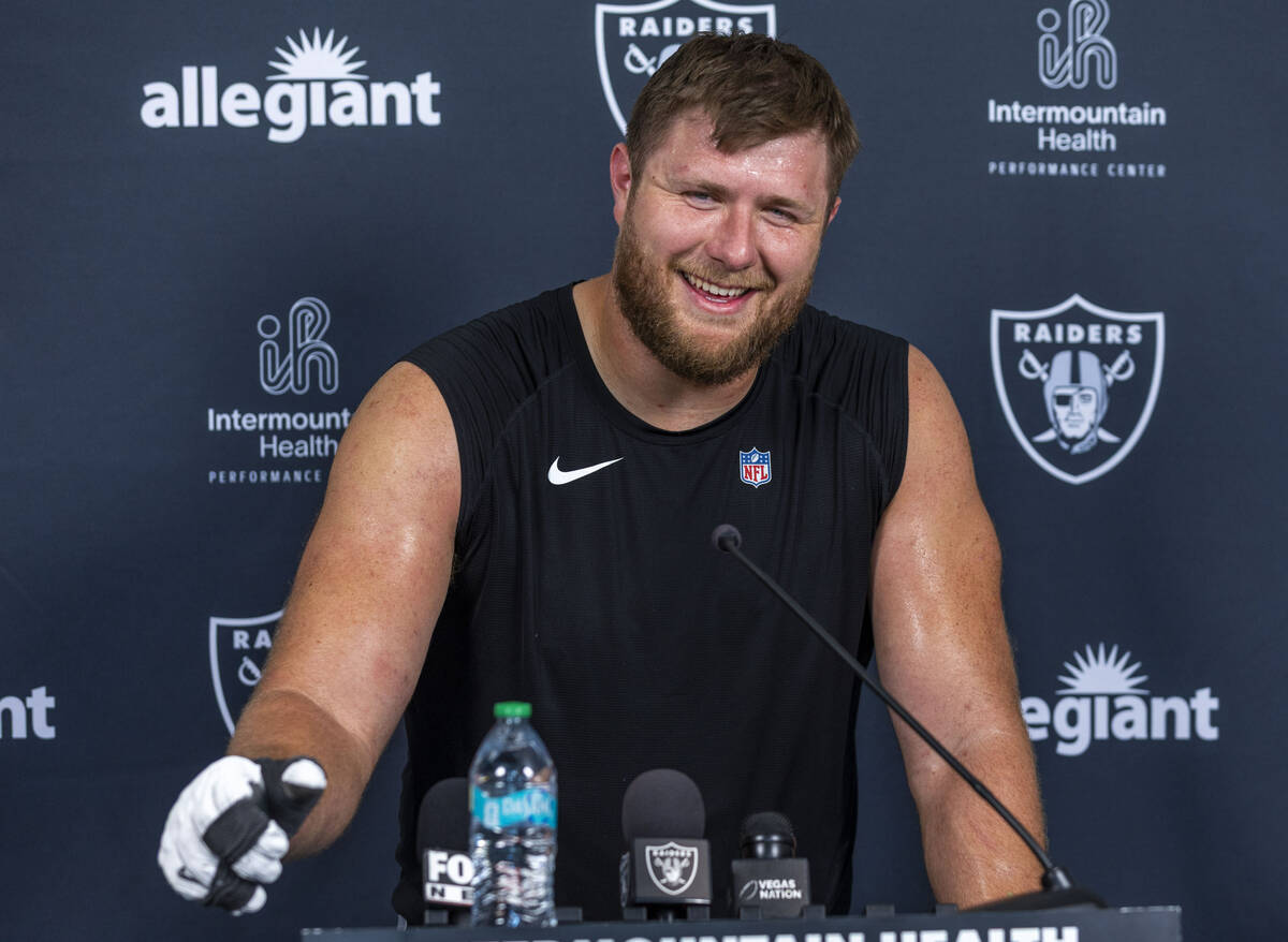 Raiders offensive tackle Kolton Miller (74) answers a question during an interview at training ...