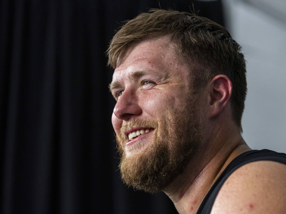 Raiders offensive tackle Kolton Miller (74) answers a question during an interview at training ...