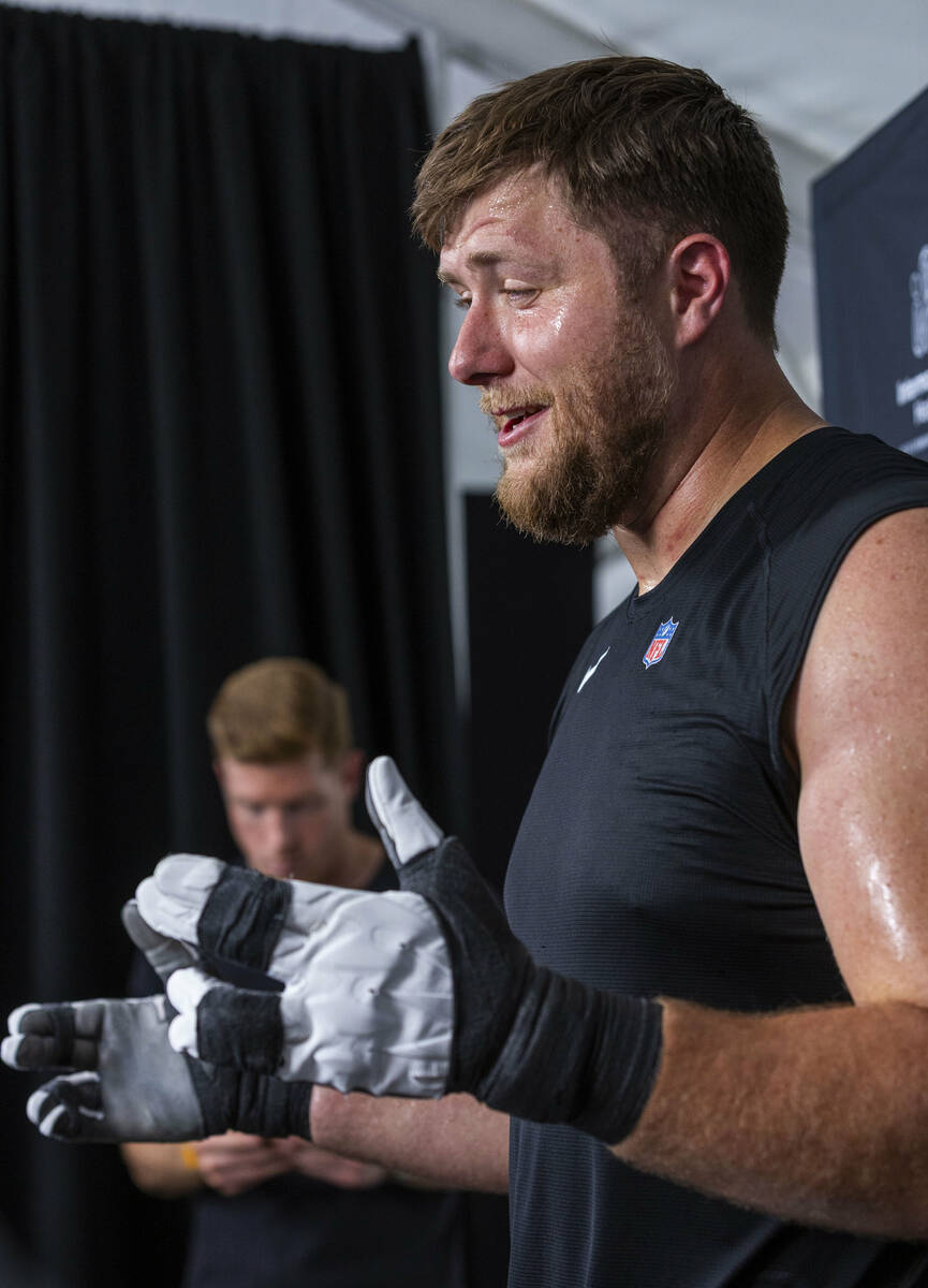 Raiders offensive tackle Kolton Miller (74) answers a question during an interview at training ...