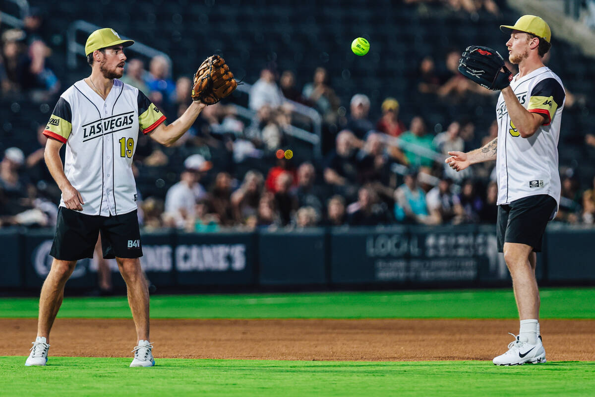 Golden knights teammates Reilly smith (19) and Jack Eichel (9) play catch during a Battle For V ...