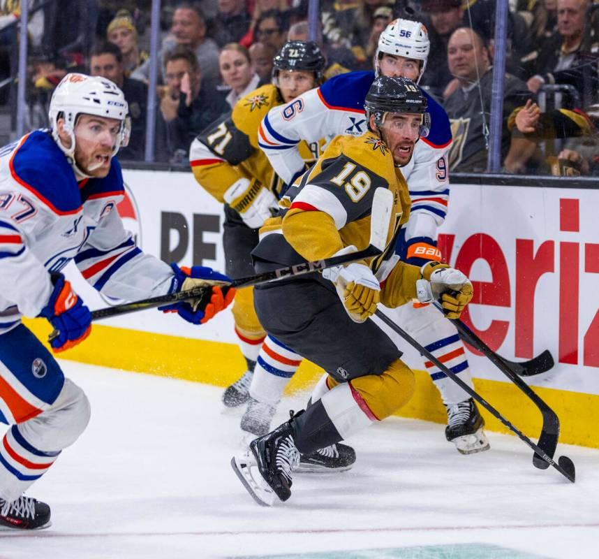 Golden Knights right wing Reilly Smith (19) and Edmonton Oilers center Connor McDavid (97) chas ...