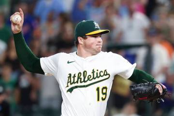 Athletics pitcher Mason Miller throws to the Toronto Blue Jays during the ninth inning of a bas ...