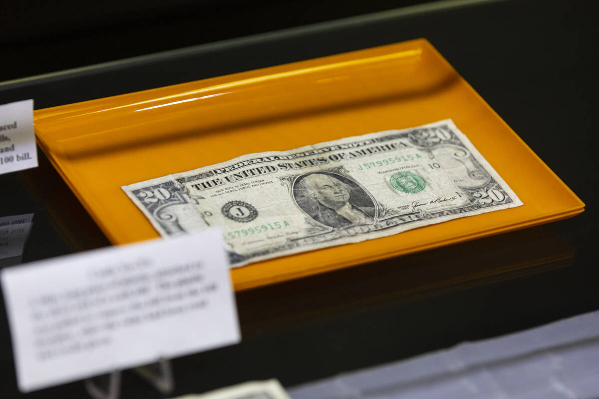 A “Frankenstein” bill, where the ends of a $20 bill are attached to a $1 bill, is ...