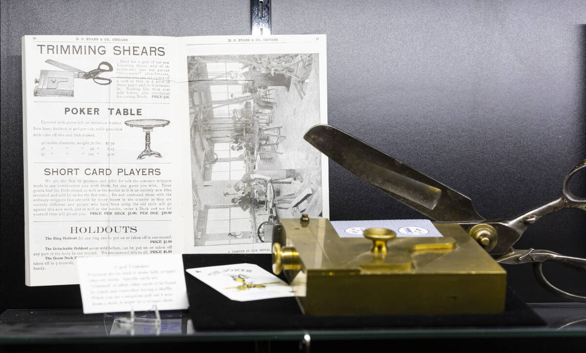 Card trimming shears used to make adjustments to mark playing cards are seen in a display case ...