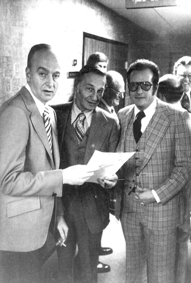 Las Vegas casino operator Frank "Lefty" Rosenthal, left, looks over paperwork with attorney Har ...