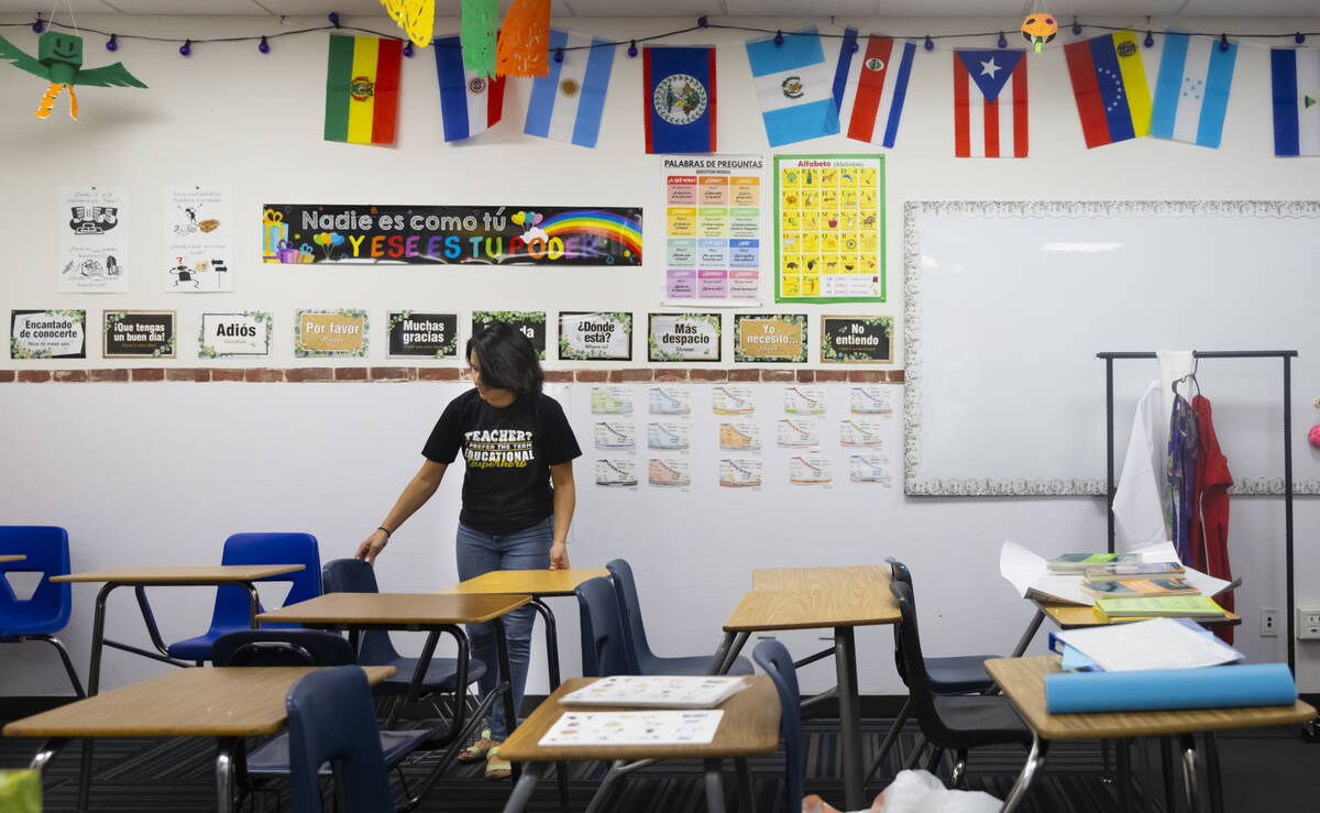 Spanish teacher Diana Lusson organizes her classroom at The Delta Academy, a charter school, ah ...