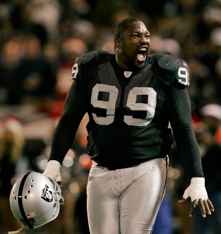Oakland Raiders' Warren Sapp yells toward the crowd during a break in action against the Kansas ...
