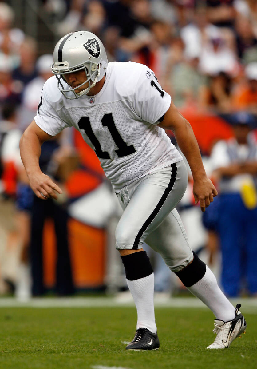 Oakland Raiders placekicker Sebastian Janikowski gets ready to kick a field goal in the third q ...