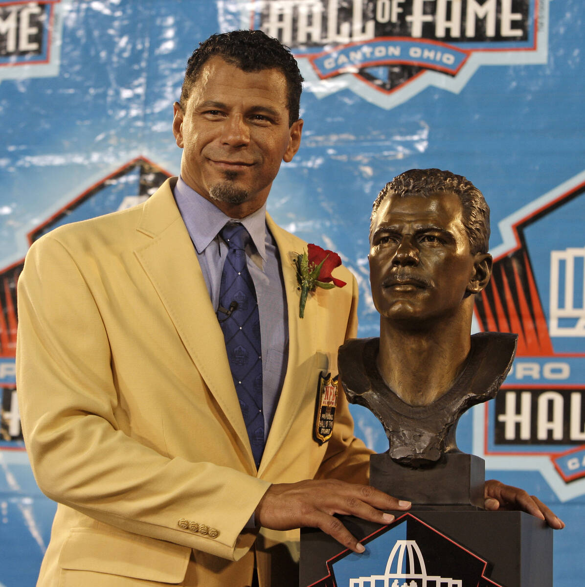 Former Oakland Raiders player Rod Woodson stands with his bronze bust during the Pro Football H ...