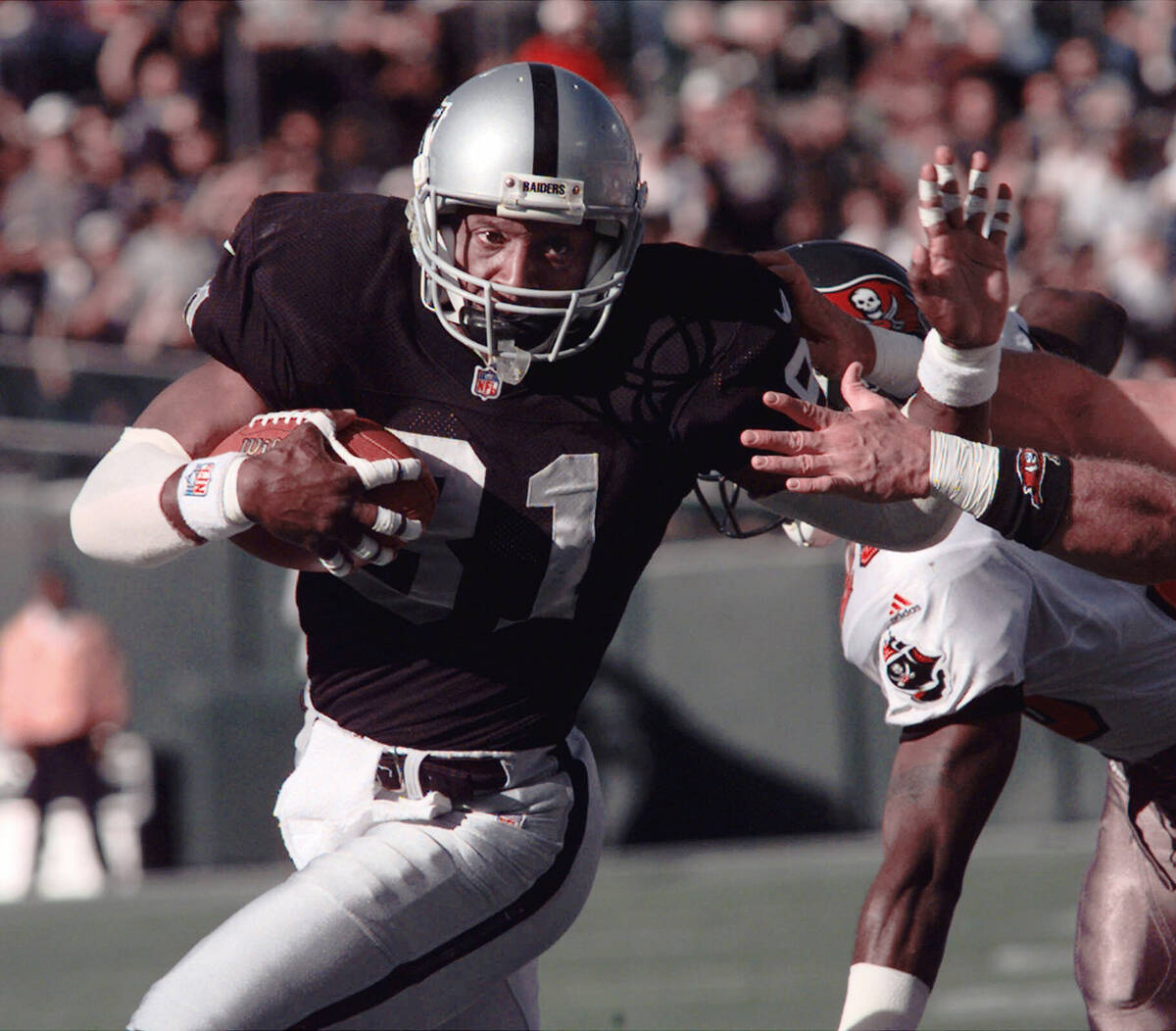 FILE - This Dec. 19, 1999 file photo shows Oakland Raiders wide receiver Tim Brown scoring in t ...
