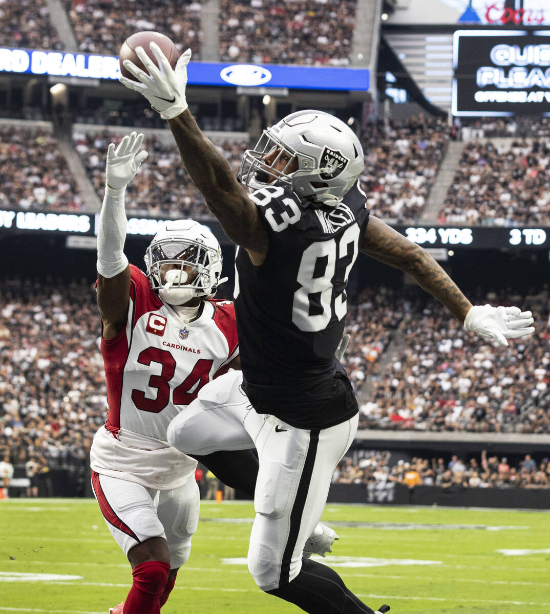 Raiders tight end Darren Waller (83) stretches to catch the ball as Arizona Cardinals safety Ja ...