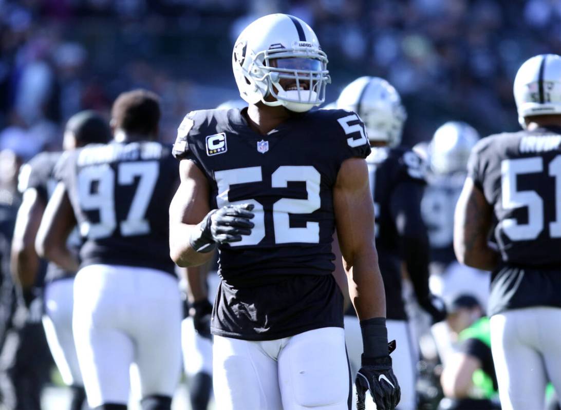 Oakland Raiders defensive end Khalil Mack (52) takes the field for warm up drills prior to the ...