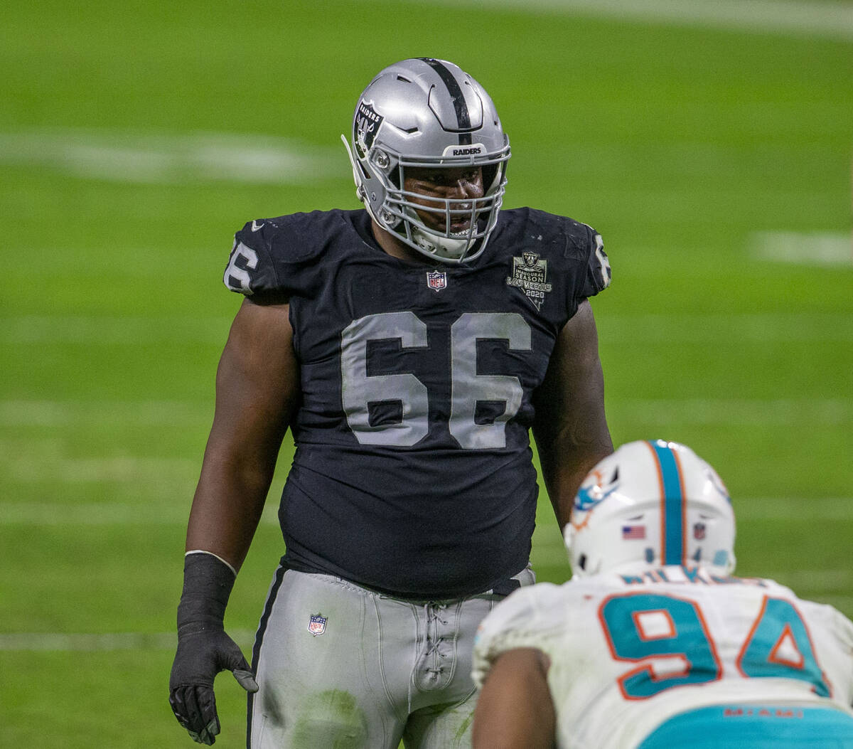 Raiders offensive guard Gabe Jackson (66) sets up against Miami Dolphins defensive end Christia ...