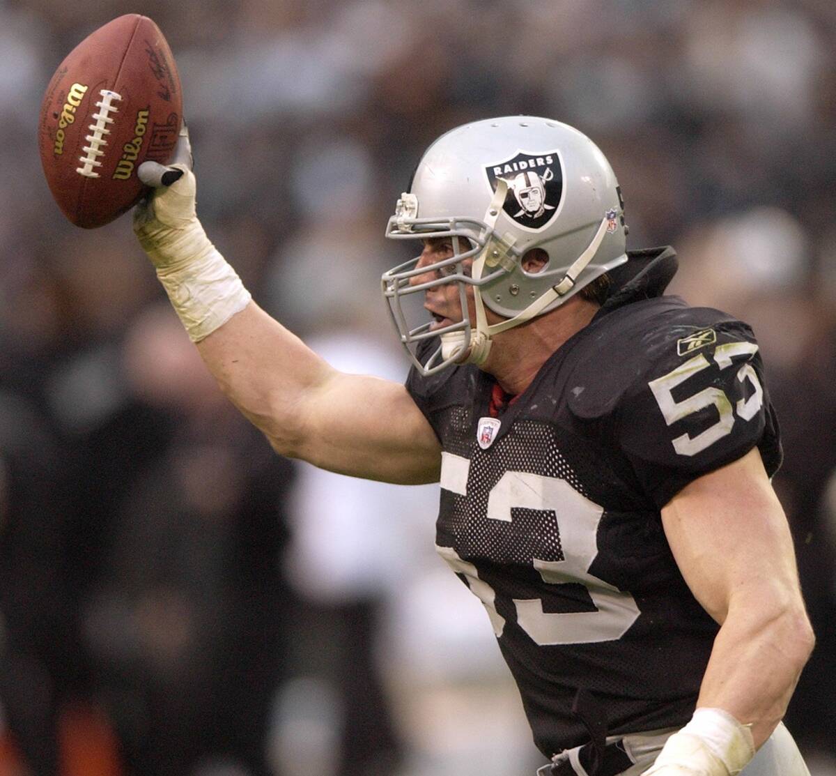 Oakland Raiders' Bill Romanowski celebrates his fourth-quarter fumble recovery against the New ...