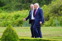 U.S. President Donald Trump, right, and British Prime Minister Keir Starmer walk at Trump Inter ...