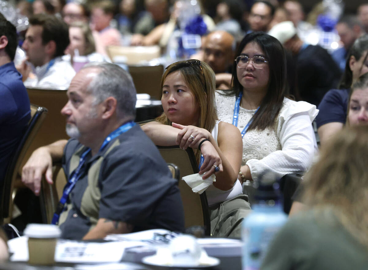 Timothy Morales, left, who will be teaching at Spring Valley High School, Ma Fenella, center, a ...