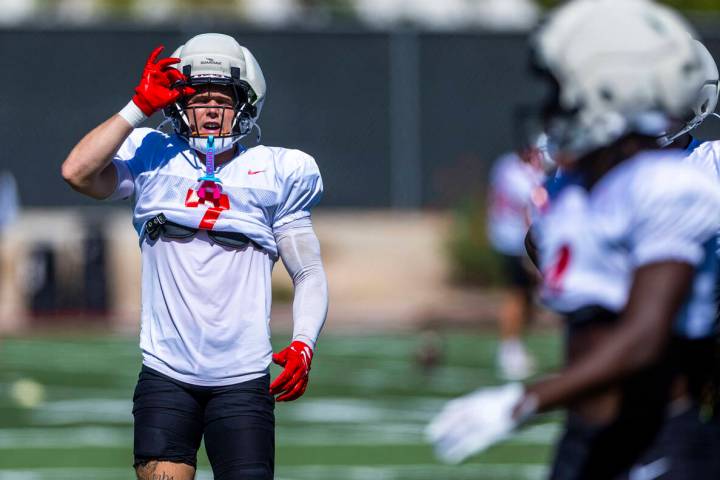 UNLV defensive back Jake Pope (7) signals to teammates as they set up for the next play during ...
