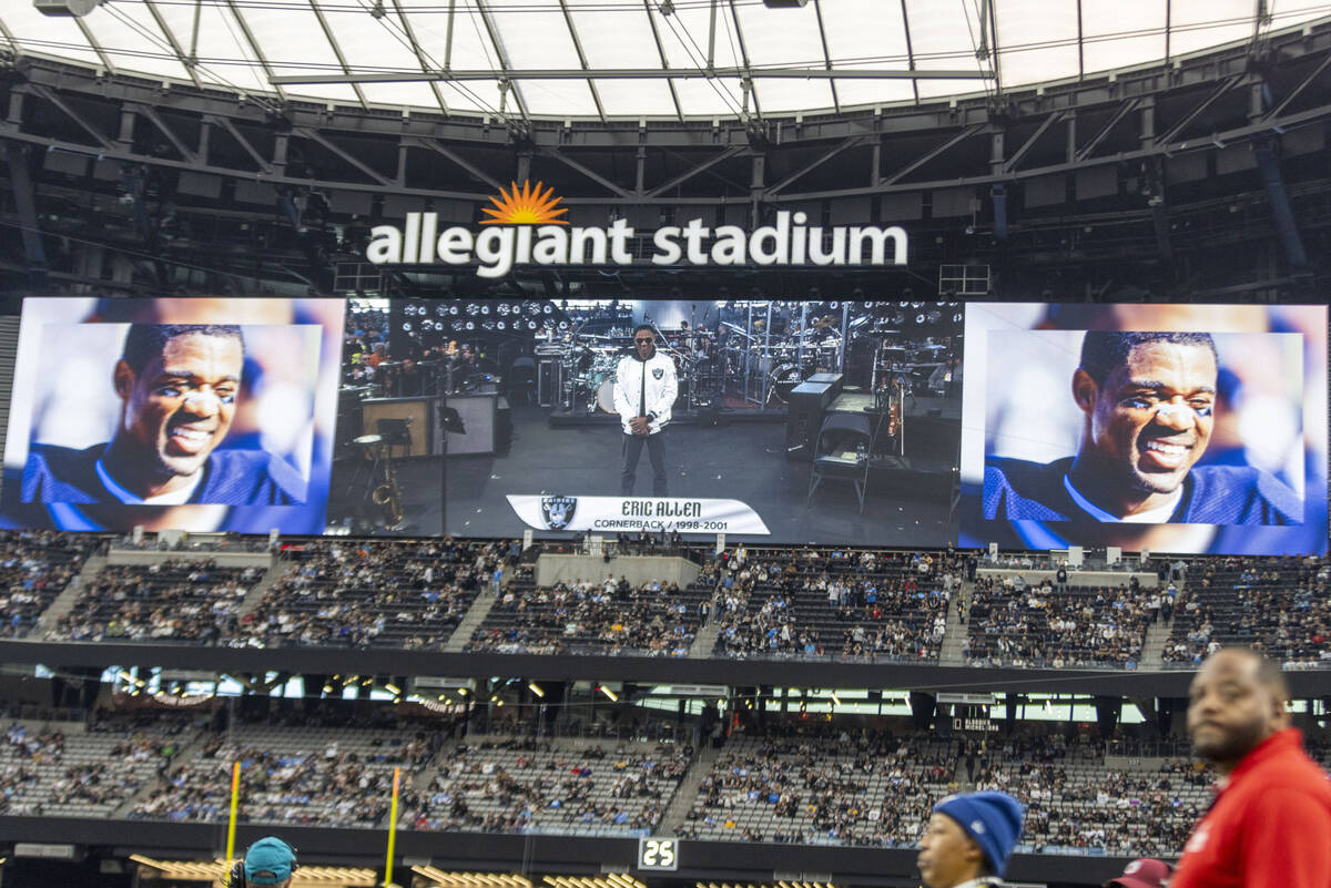 Former Raiders cornerback Eric Allen lights the Al Davis Memorial Torch before an NFL game agai ...