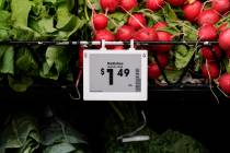 Electronic grocery labels are displayed at a Kroger grocery store, in Monroe, Ohio, Nov. 13, 20 ...