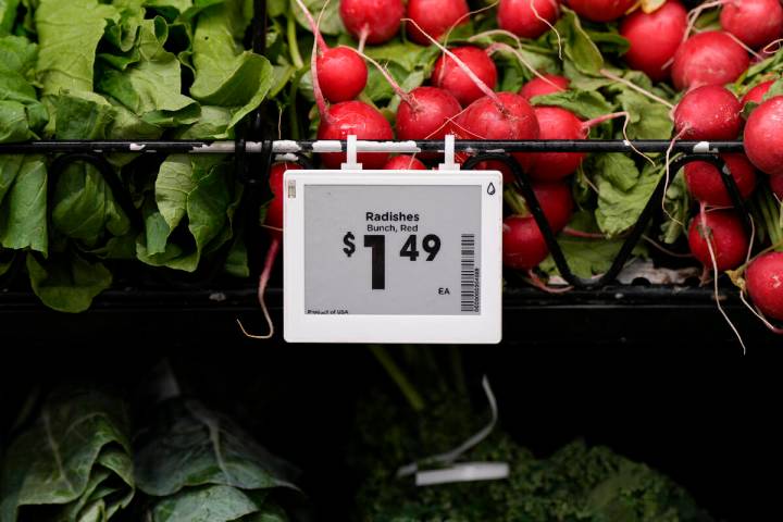 Electronic grocery labels are displayed at a Kroger grocery store, in Monroe, Ohio, Nov. 13, 20 ...