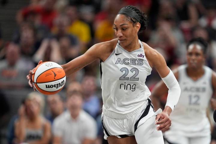 Las Vegas Aces' A'ja Wilson dribbles during the second half of a WNBA basketball game against t ...