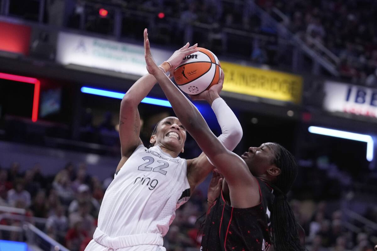 Las Vegas Aces' A'ja Wilson (22) shoots against Indiana Fever's Aliyah Boston during the second ...