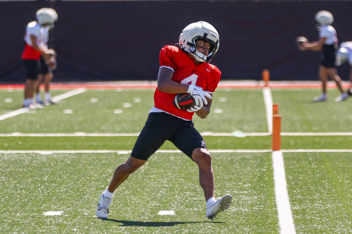 UNLV wide receiver DeAngelo Irvin Jr. (4) catches the ball during a drill at football practice ...