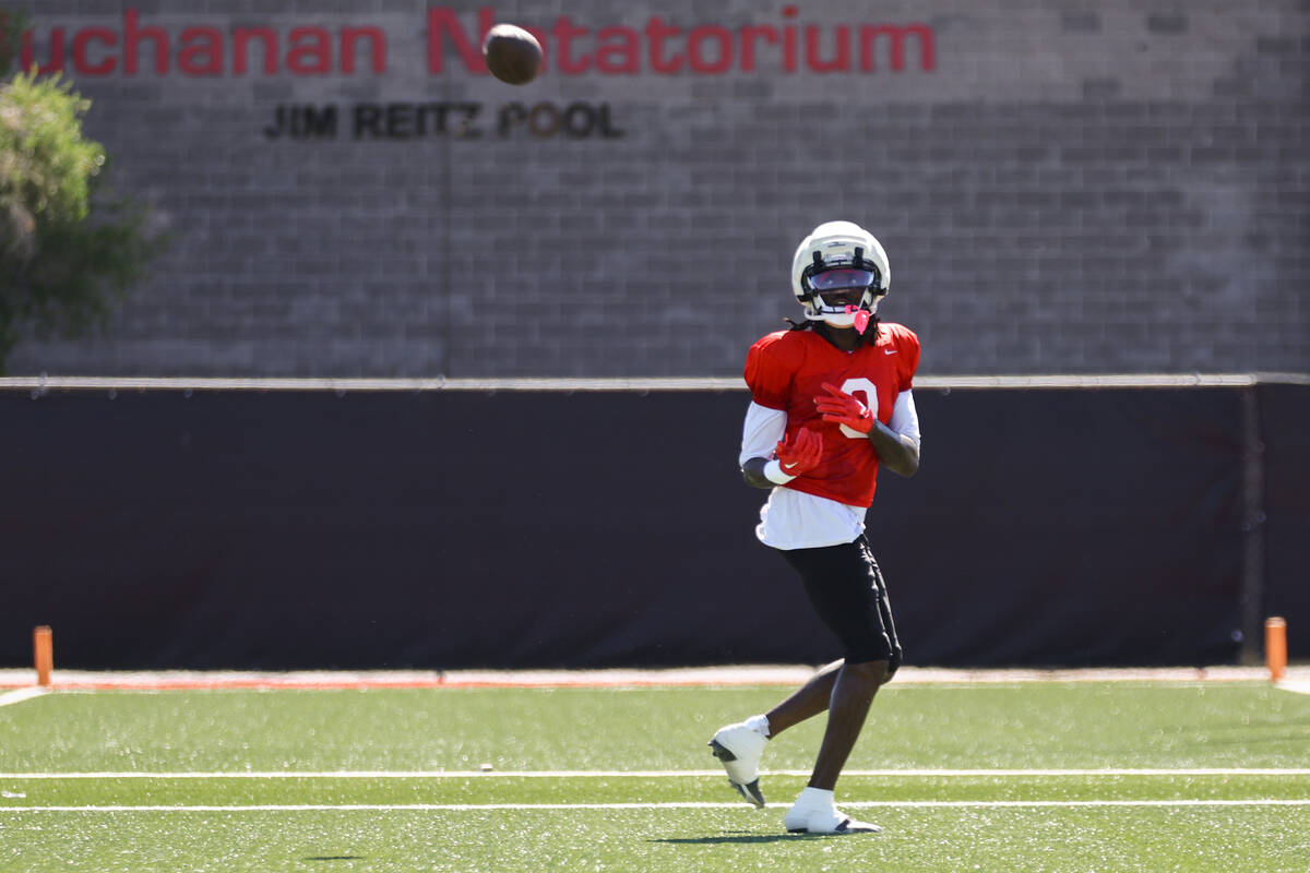 UNLV wide receiver Troy Omeire (0) catches the ball during a drill at football practice on Thur ...