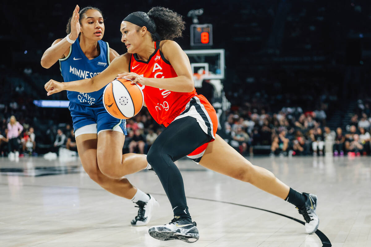 Aces guard Aaliyah Nye (13) drives the ball during a WNBA basketball game between the Aces and ...