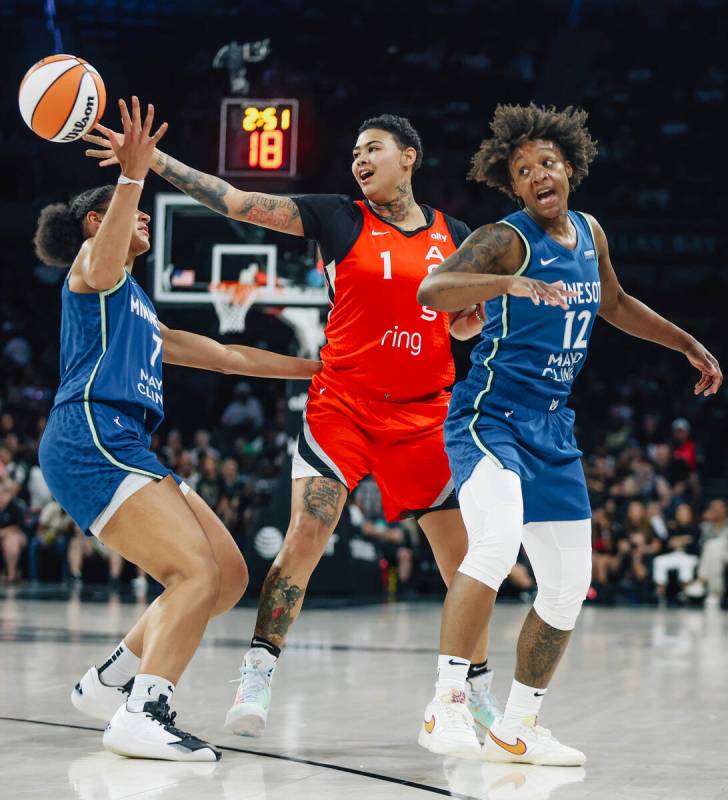 Aces forward Kierstan Bell (1) reaches for a loose ball during a WNBA basketball game between t ...
