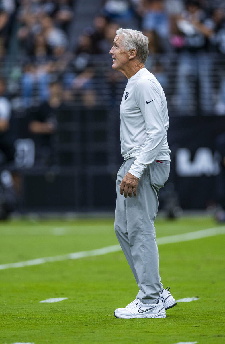 Raiders head coach Pete Carroll looks to the fans during the first half of a Raiders training c ...