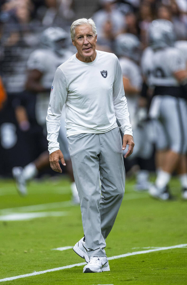 Raiders head coach Pete Carroll looks to the fans during the first half of a Raiders training c ...