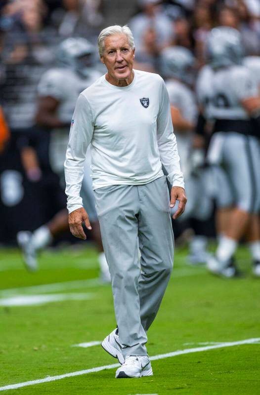 Raiders head coach Pete Carroll looks to the fans during the first half of a Raiders training c ...