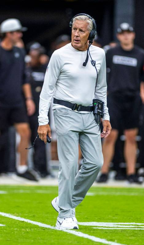 Raiders head coach Pete Carroll watches his players in action during the first half of a Raider ...