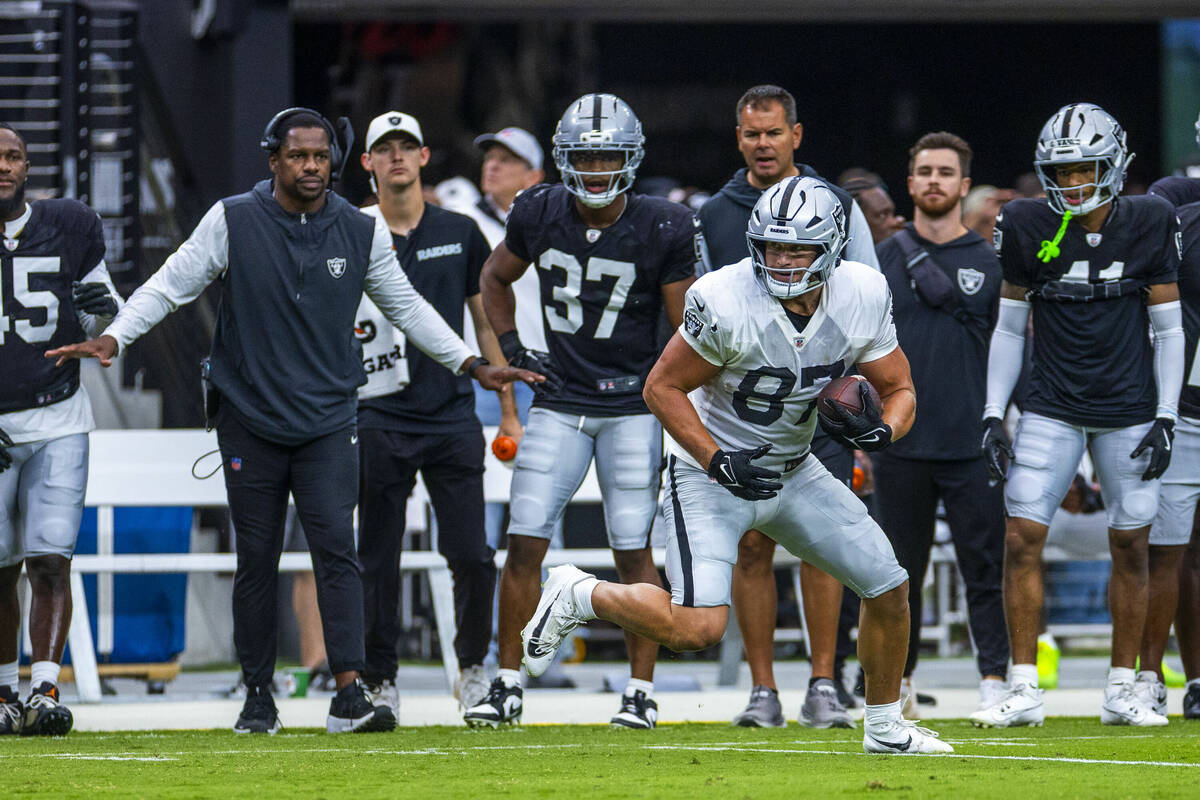 Raiders tight end Michael Mayer (87) looks for room to run after a catch during the first half ...