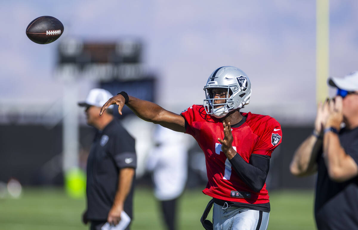 Raiders quarterback Geno Smith (7) gets off a pass during training camp on Thursday, July 31, 2 ...