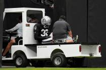 Las Vegas Raiders cornerback Lonnie Johnson Jr. (32) is carted off the field at the team's NFL ...