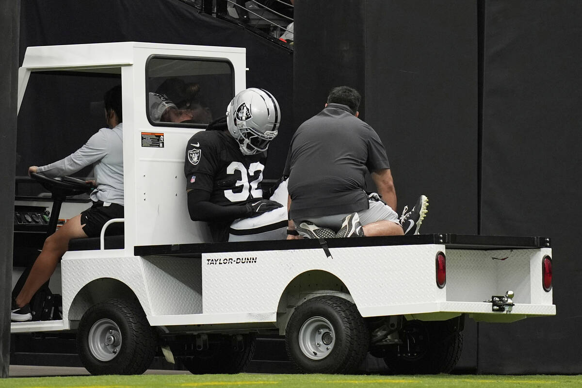 Las Vegas Raiders cornerback Lonnie Johnson Jr. (32) is carted off the field at the team's NFL ...