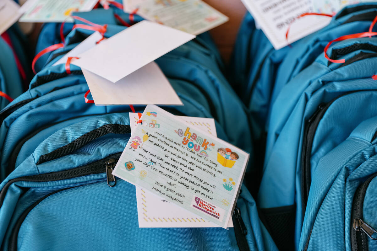 Notes from Clark County Commissioner Marilyn Kirkpatrick decorate school backpacks that were gi ...
