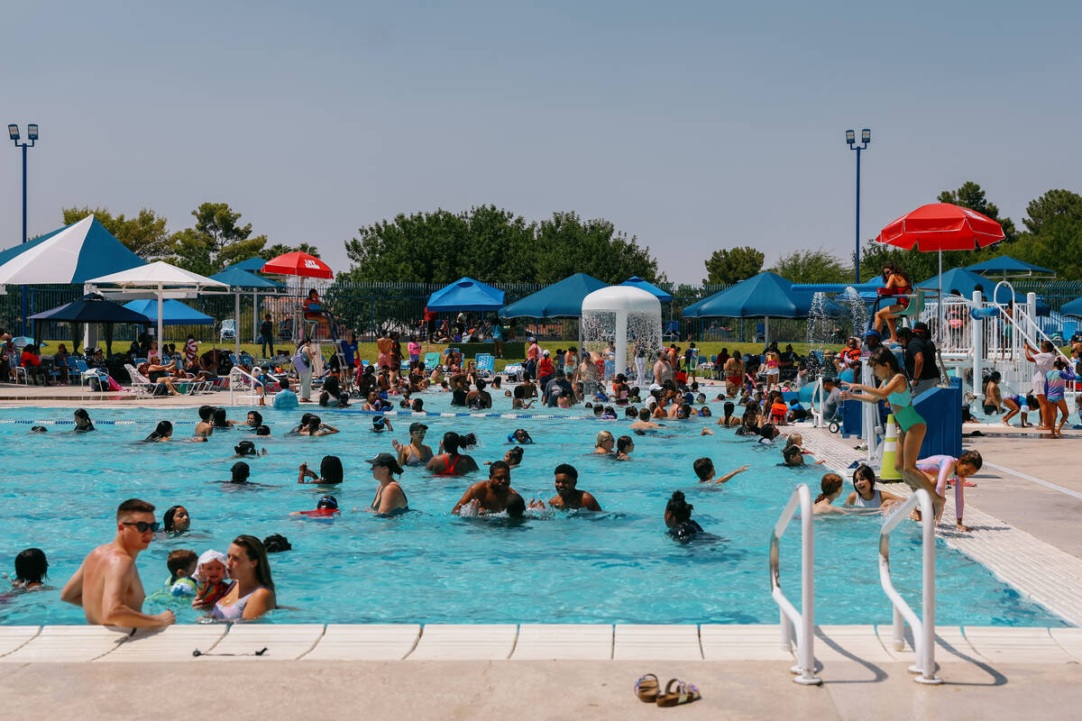 Families attend the City of North Las Vegas’s back-to-school pool party on Saturday, Aug ...