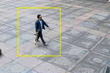 This image from surveillance video obtained by The Associated Press shows Shane Tamura outside ...