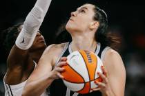 Aces center Megan Gustafson (17) puts up a shot during a WNBA game between the Aces and Golden ...