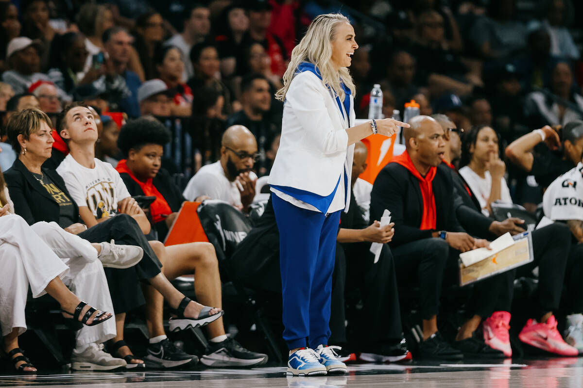 Aces head coach Becky Hammon smiles during a WNBA game between the Aces and Golden State Valkyr ...
