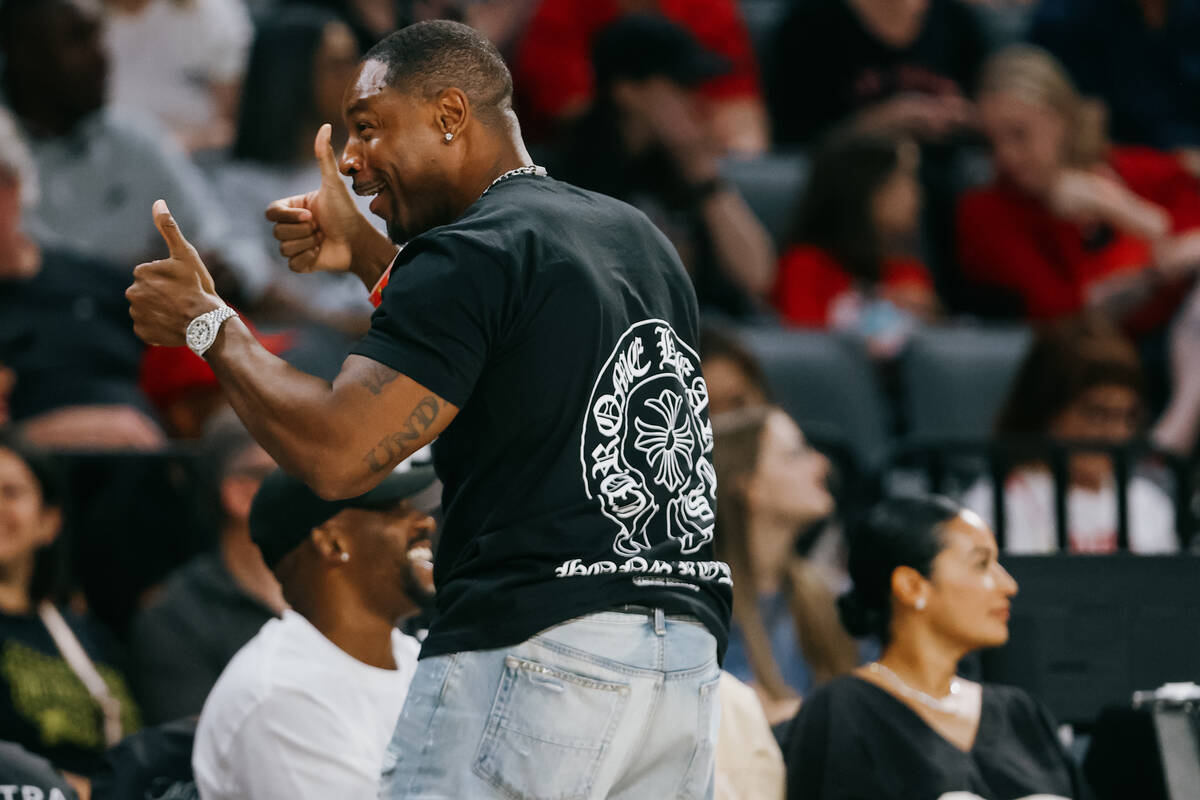 R&B singer Tank, who is an Aces fan, gets animated as the Aces are up during a WNBA game be ...